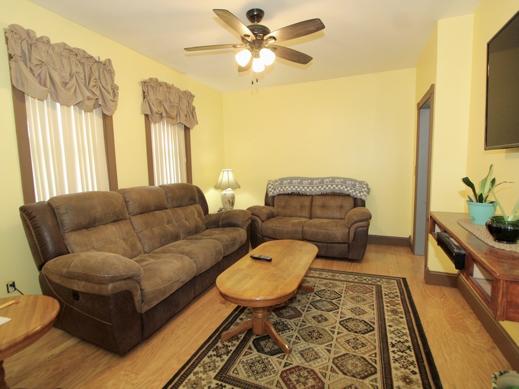 18 South Stowell Street Worcester, MA 01604 - Photo 6 of 16 a living room with furniture and a large window