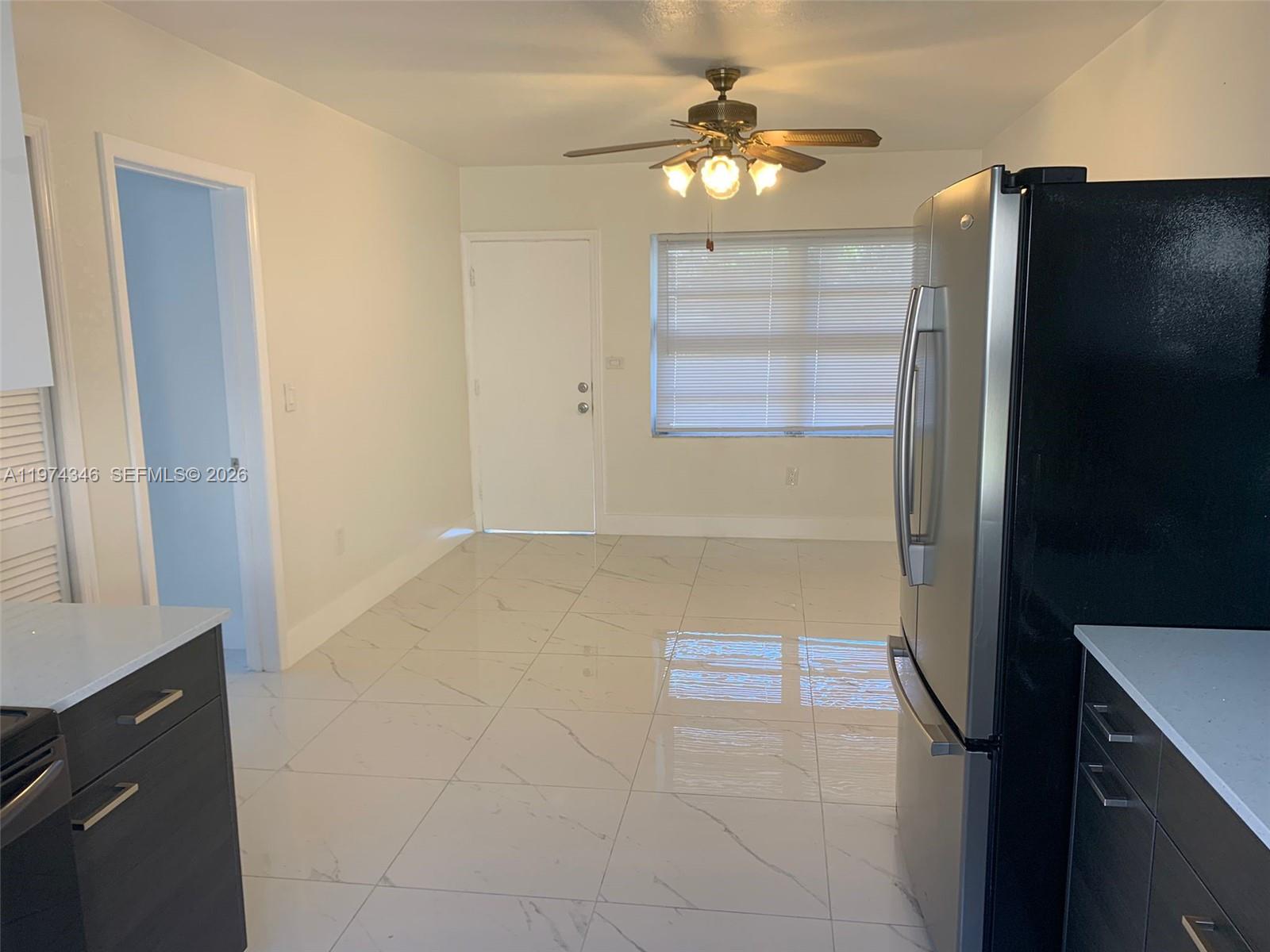 375 East 4th Avenue, Unit 4 Hialeah, FL 33010 - Photo 1 of 1 a view of an empty room with a window