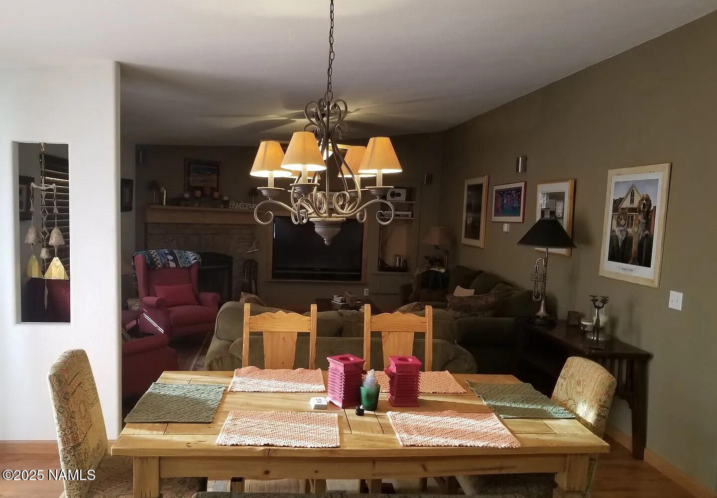 12970 Doyle Road Flagstaff, AZ 86004 - Photo 12 of 26 a view of a dining room with furniture a chandelier and wooden floor