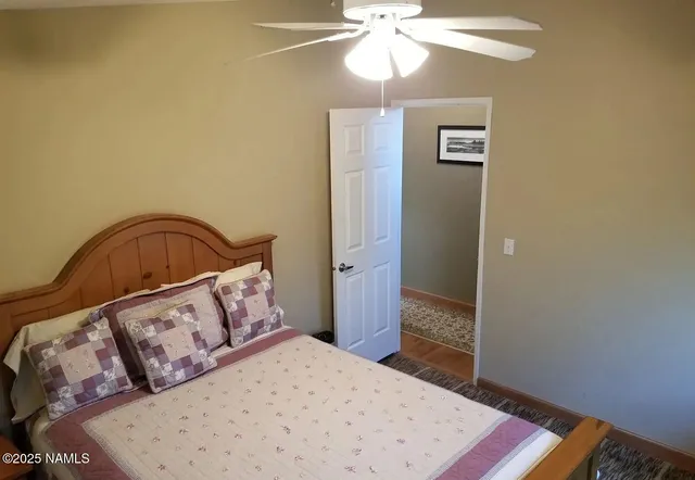 a bedroom with a bed and a dresser