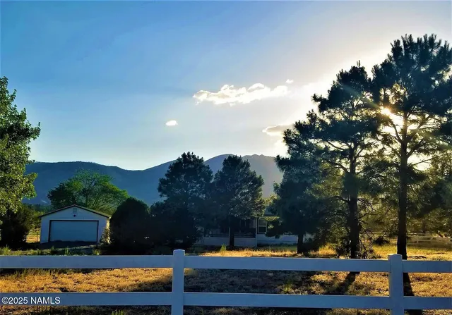 a view of house with outdoor space and sitting area
