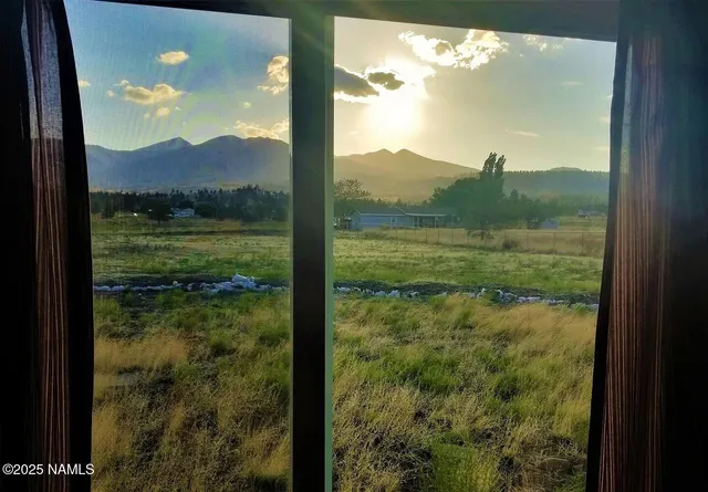 a view of a glass door and a window