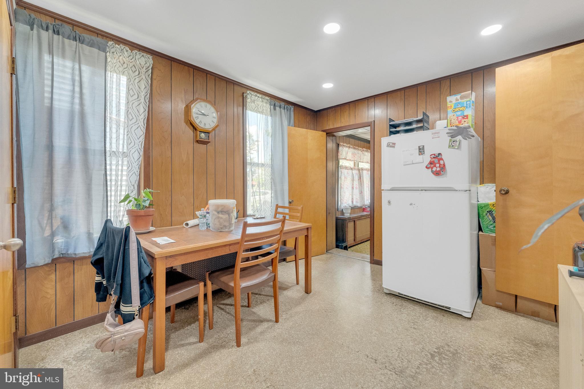 152 Division Street Trenton, NJ 08611 - Photo 19 of 24 a white kitchen with a table and chairs