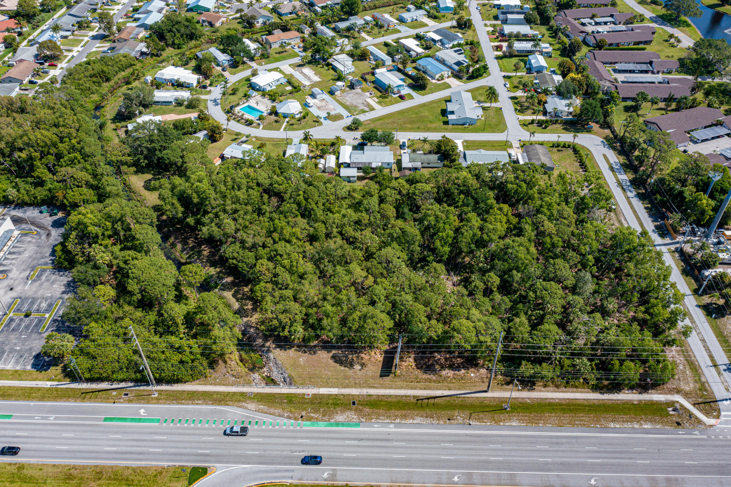0 Southeast Federal Highway Stuart, FL 34994 - Photo 7 of 26 a view of building with yard and large trees