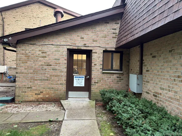 a brick building with a door
