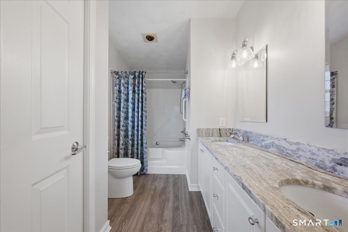 25 Heather Brook Road Montville, CT 06382 - Photo 21 of 39 a bathroom with a granite countertop sink toilet and shower
