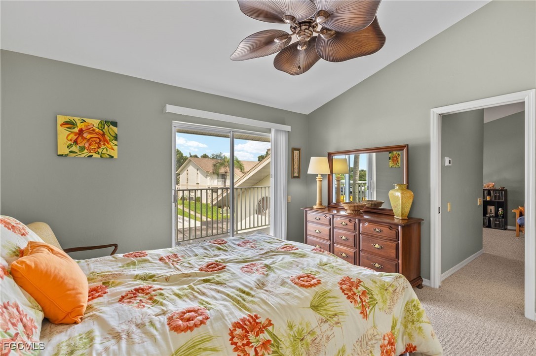 6891 Pentland Way, Unit 91 Fort Myers, FL 33966 - Photo 22 of 33 a bedroom that has a bed and a chandelier