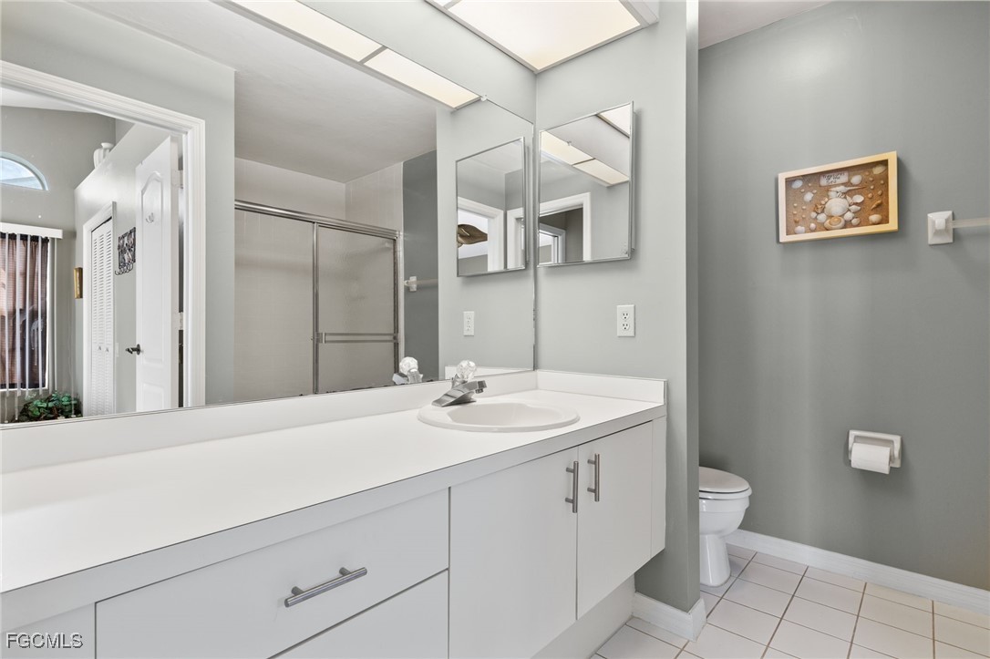 6891 Pentland Way, Unit 91 Fort Myers, FL 33966 - Photo 23 of 33 a bathroom with a sink and a mirror