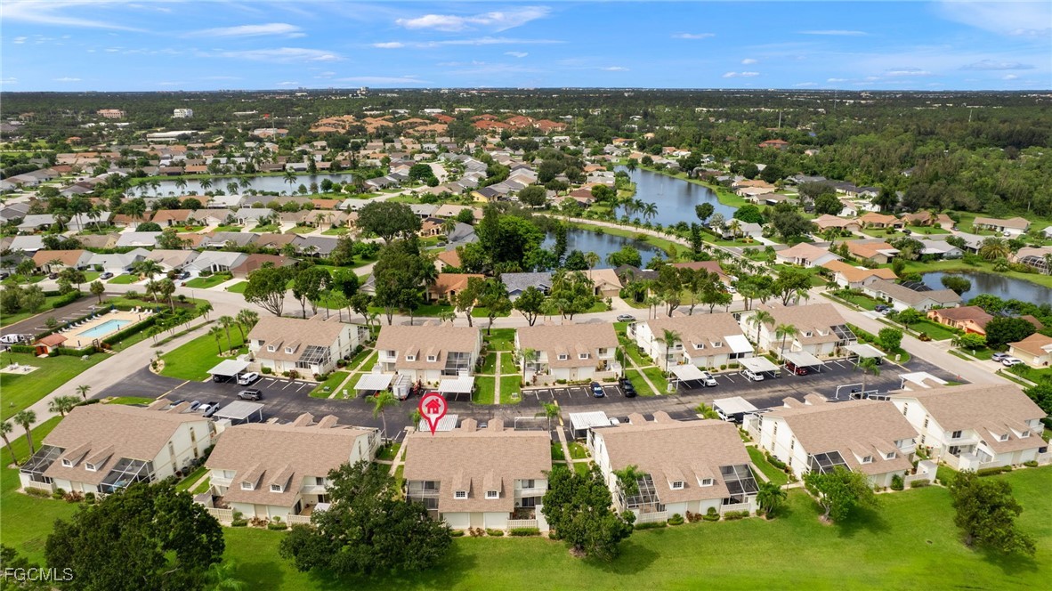 6891 Pentland Way, Unit 91 Fort Myers, FL 33966 - Photo 27 of 33 an aerial view of residential houses with outdoor space