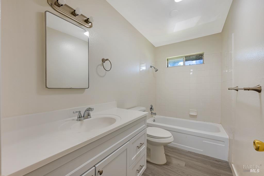 1155-1175 Evans Drive Santa Rosa, CA 95405 - Photo 28 of 31 a bathroom with a sink a toilet and shower