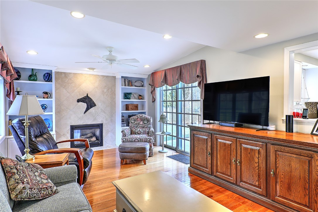 Family room with gas firelace and sliders unto large deck