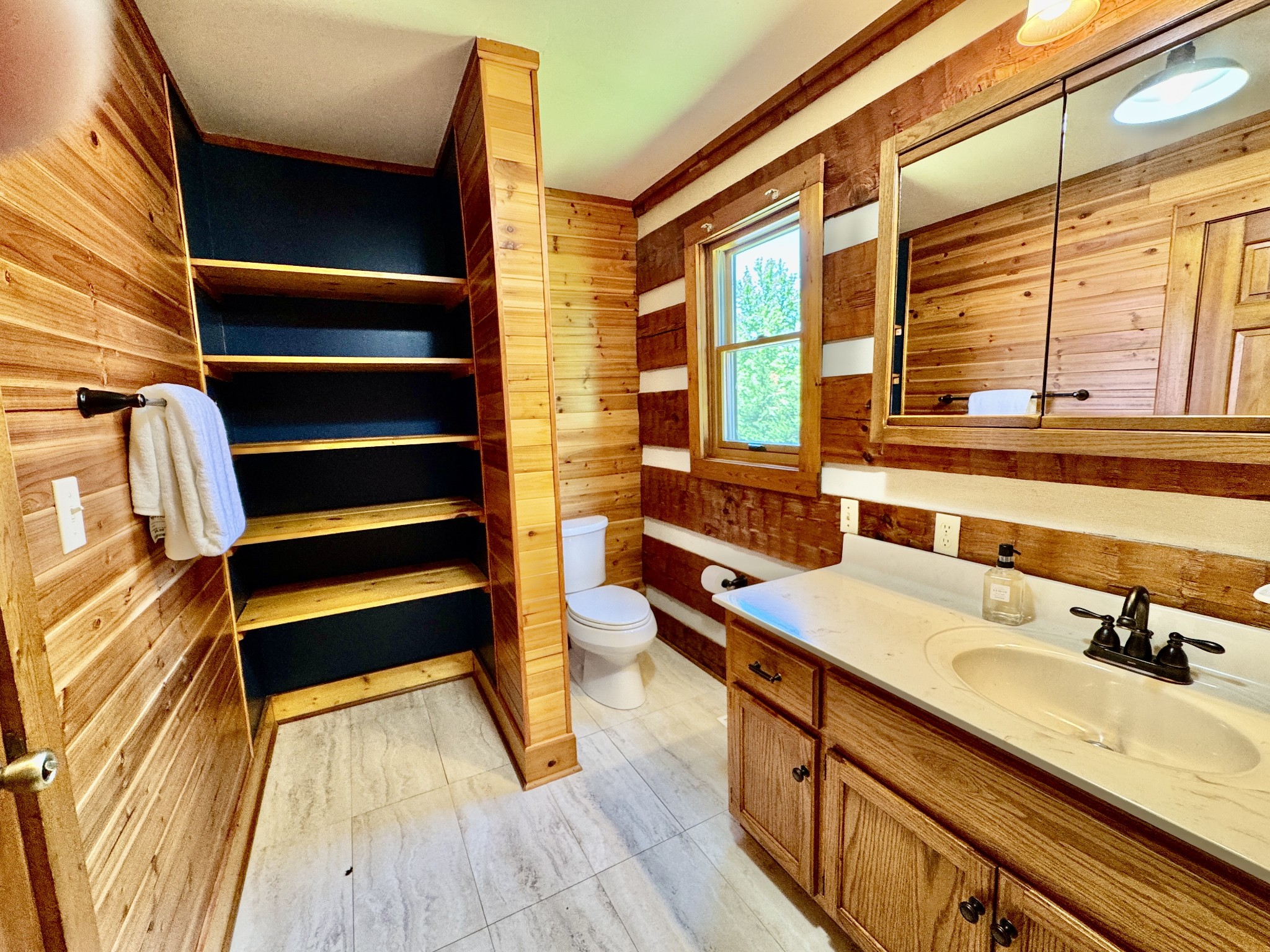 1342 Aetna Church Road Centerville, TN 37033 - Photo 23 of 59 a bathroom with a sink and a large mirror