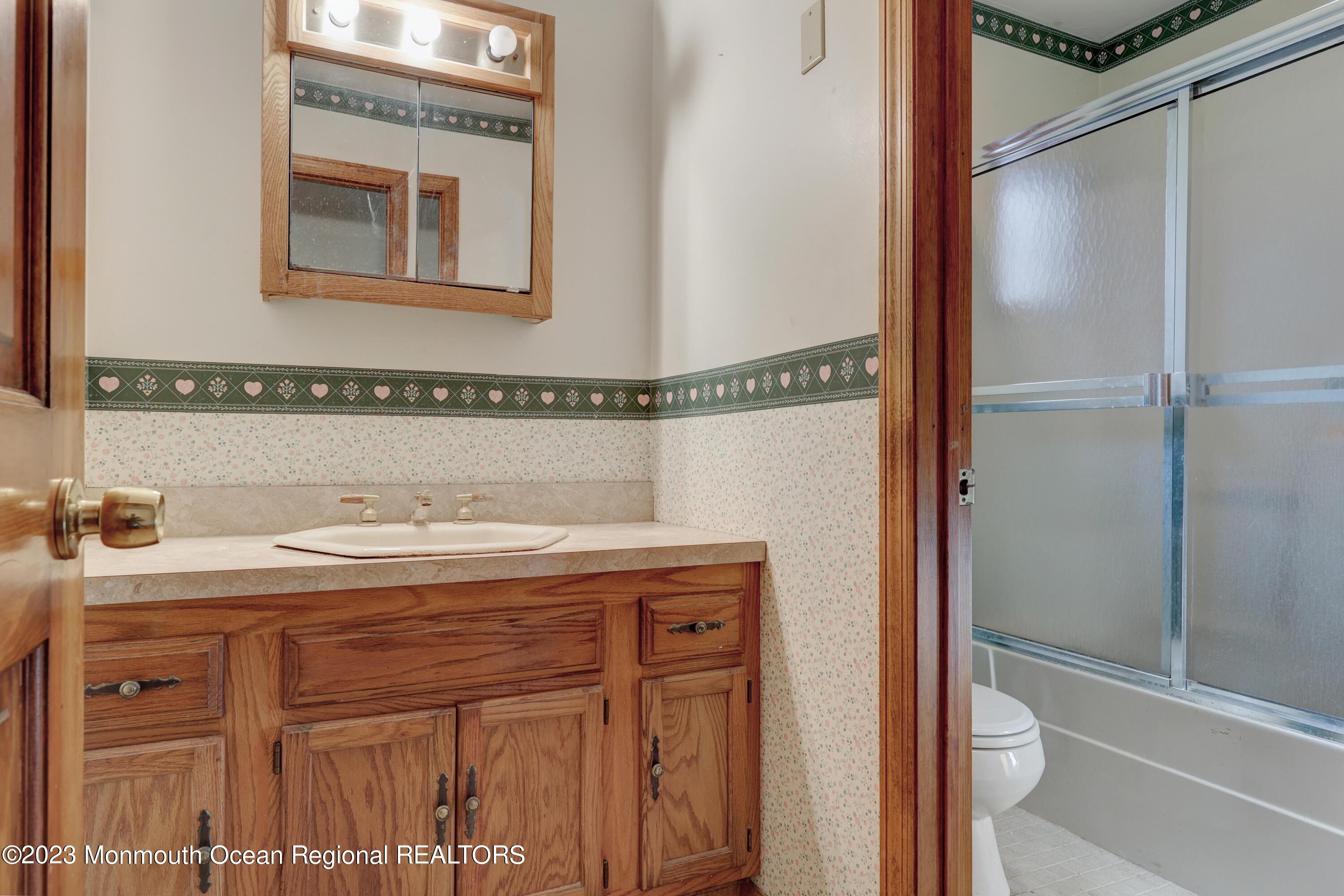25 Meirs Road Cream Ridge, NJ 08514 - Photo 15 of 17 a bathroom with a granite countertop sink and a mirror