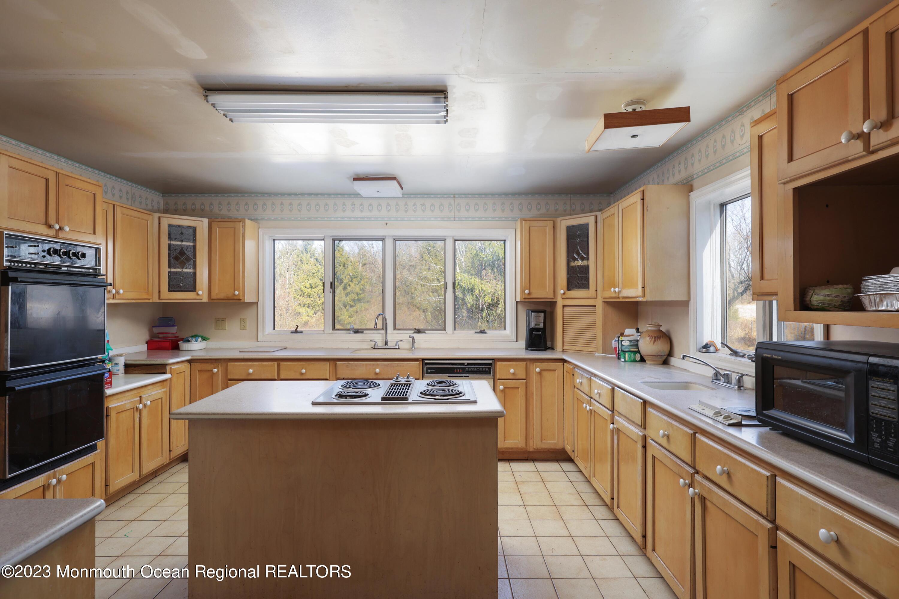 25 Meirs Road Cream Ridge, NJ 08514 - Photo 9 of 17 a kitchen with stainless steel appliances granite countertop a sink stove and refrigerator