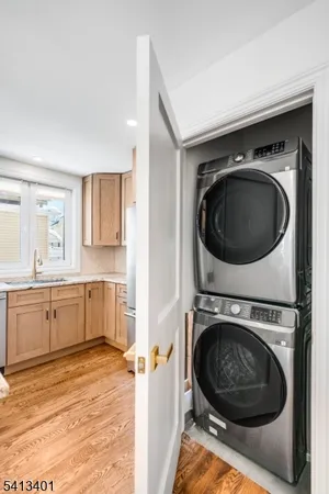 a view of a kitchen with a washer and dryer