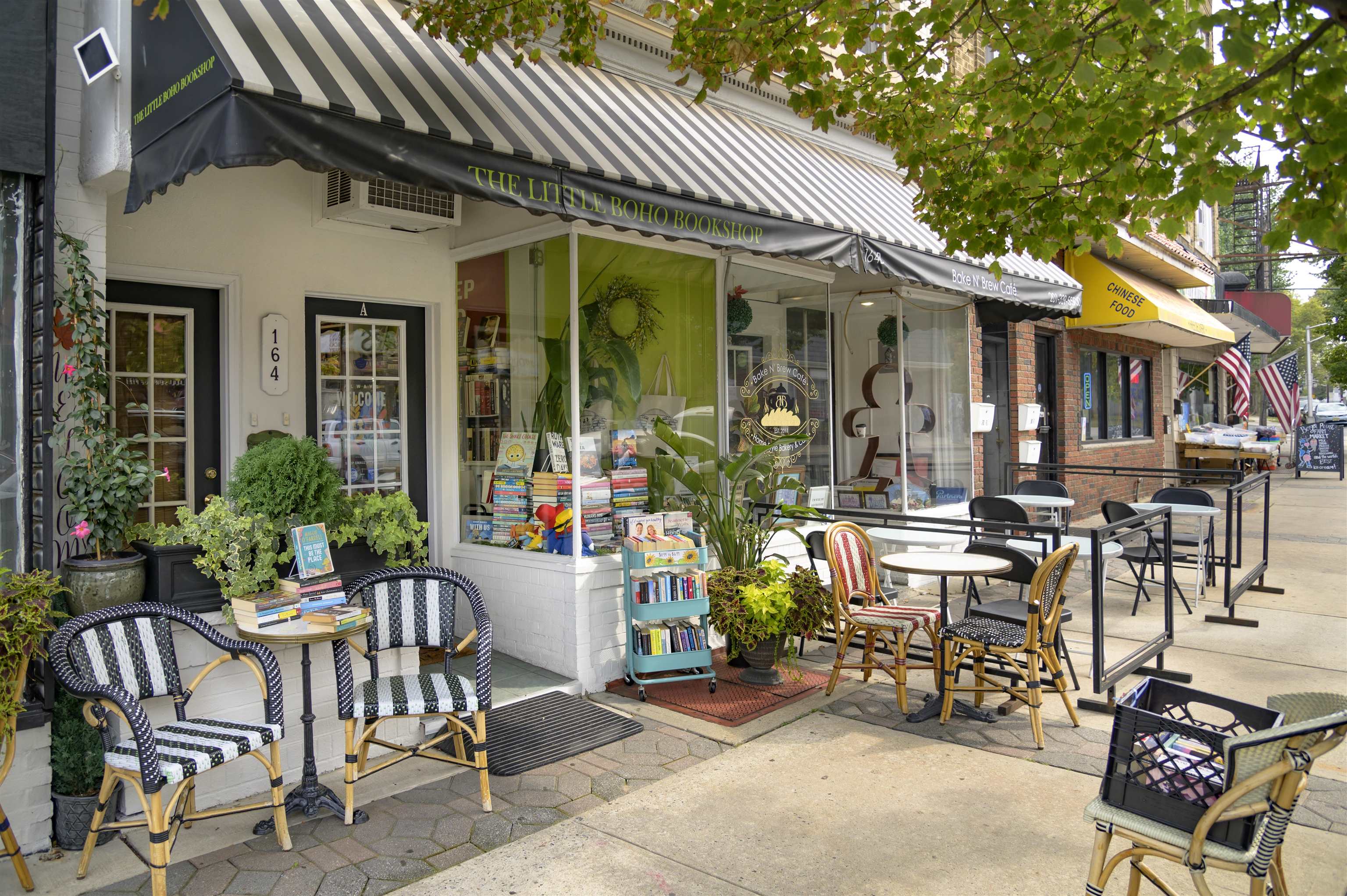 477 Broadway, Unit 409 Bayonne, NJ 07002 - Photo 18 of 19 a view of a patio with table and chairs and potted plants