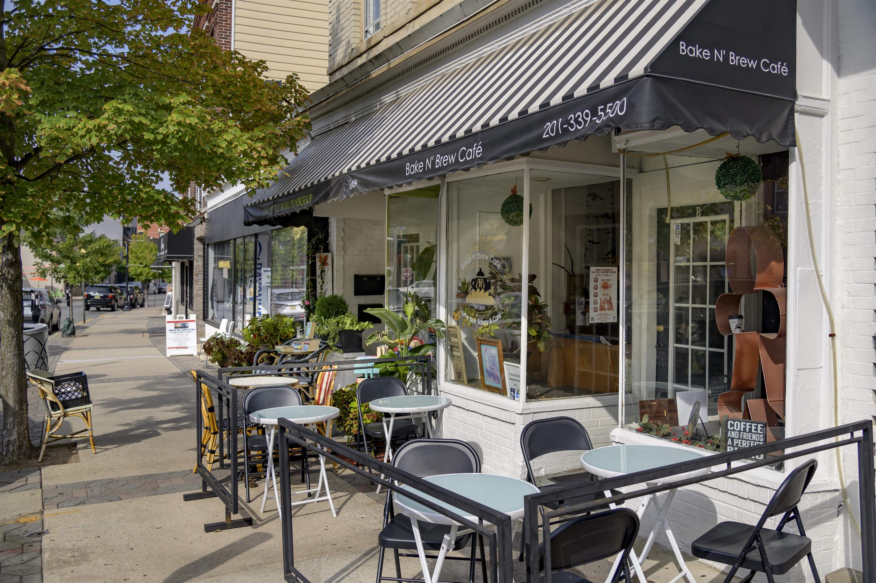 477 Broadway, Unit 409 Bayonne, NJ 07002 - Photo 19 of 19 a view of a patio with couches table and chairs and potted plants