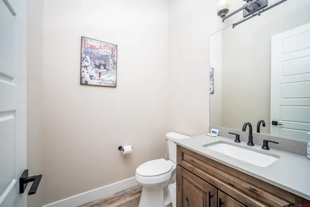 a white toilet sitting next to a bathroom sink