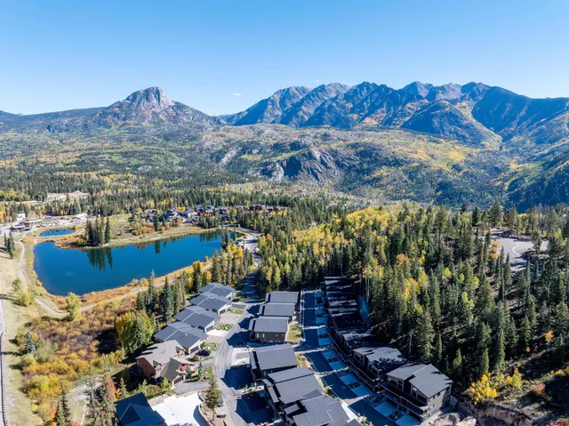 a view of a patio with a table and chairs