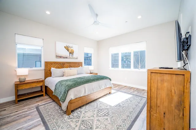 a bedroom with a large bed and a window