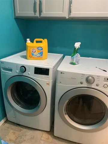 a utility room with dryer and washer