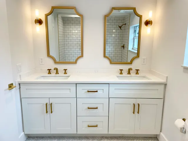 a bathroom with mirror a sink and vanity