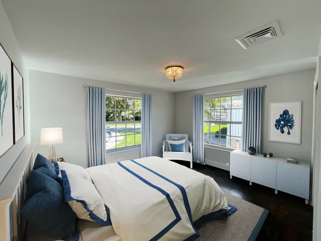 a bedroom with a bed and a couch