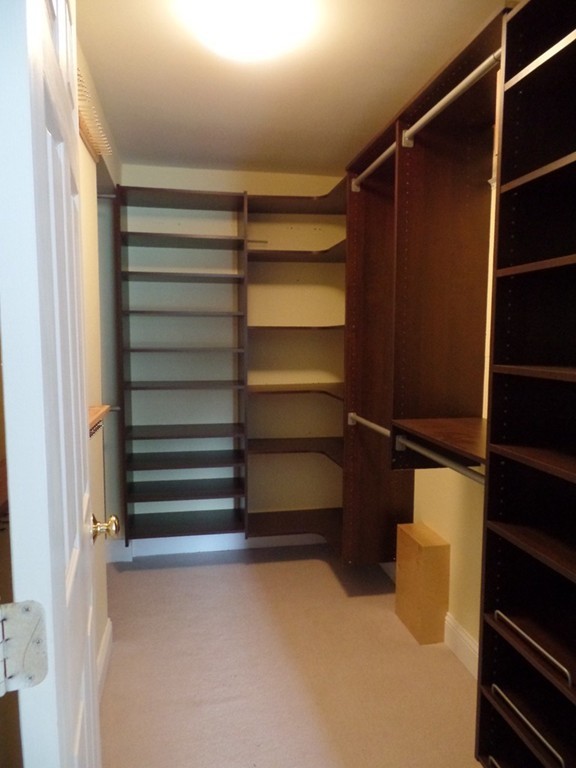 234 Stonebridge Road Wayland, MA 01778 - Photo 11 of 20 a view of walk in closet with empty racks