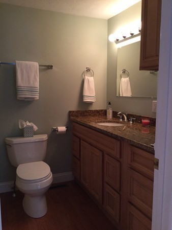 234 Stonebridge Road Wayland, MA 01778 - Photo 12 of 20 a bathroom with a granite countertop toilet sink and mirror