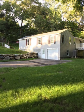 234 Stonebridge Road Wayland, MA 01778 - Photo 16 of 20 a front view of house with yard and green space