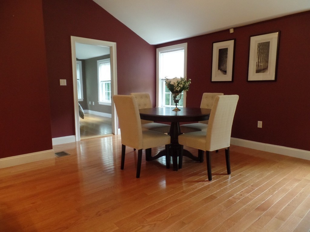 234 Stonebridge Road Wayland, MA 01778 - Photo 8 of 20 a view of a dining room with furniture and wooden floor