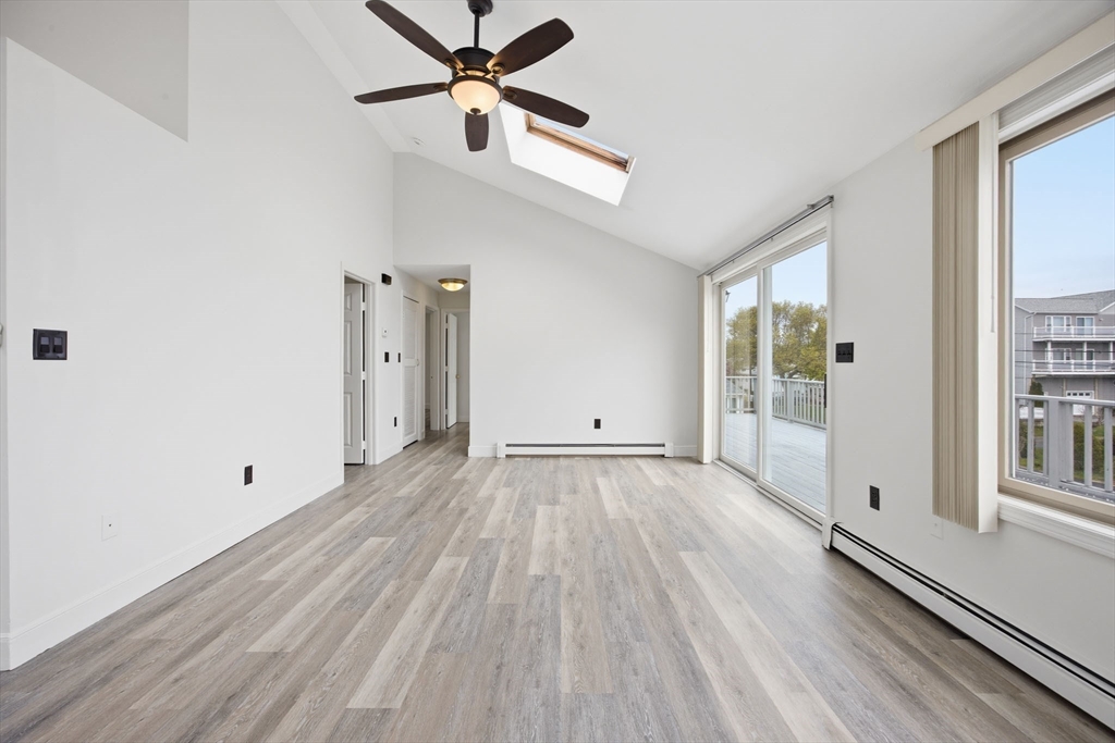 192 Swifts Beach Road Wareham, MA 02571 - Photo 24 of 38 wooden floor in an empty room with a window