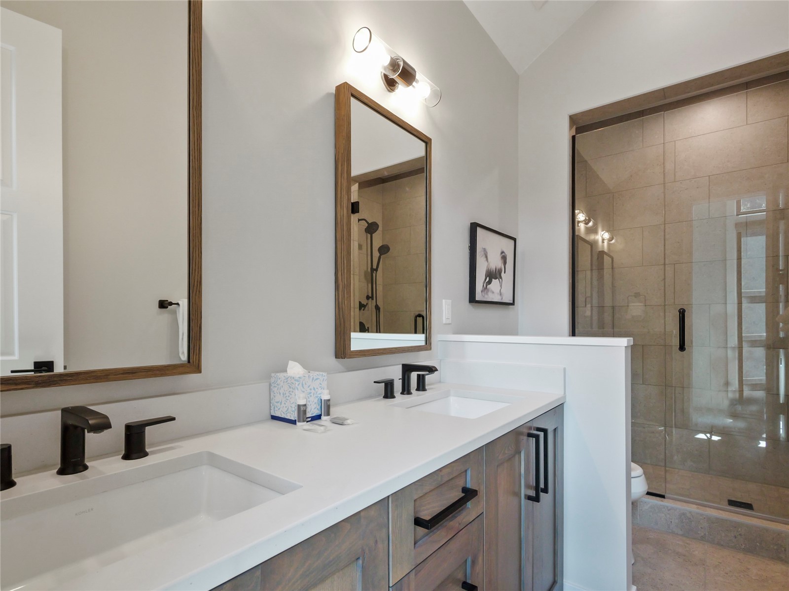 75 Alcove Court, Unit 75 Keystone, CO 80435 - Photo 24 of 40 a bathroom with double vanity sinks and a mirror
