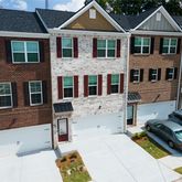 a front view of a house with many windows