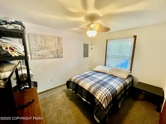a bedroom with a bed and cabinets