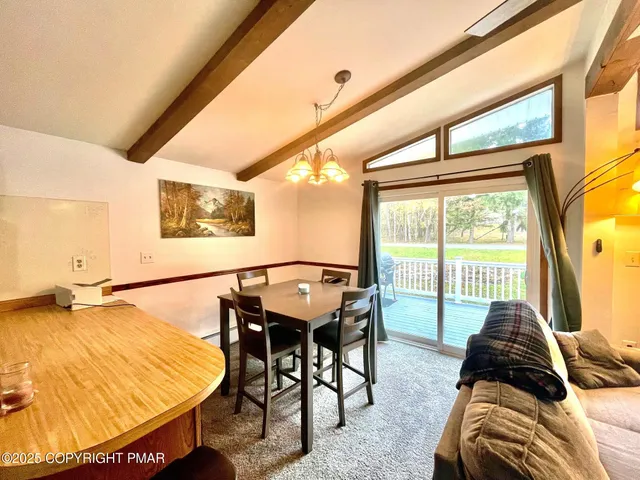a view of a living room and a balcony