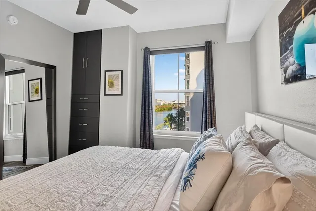 a bedroom with a bed and a window