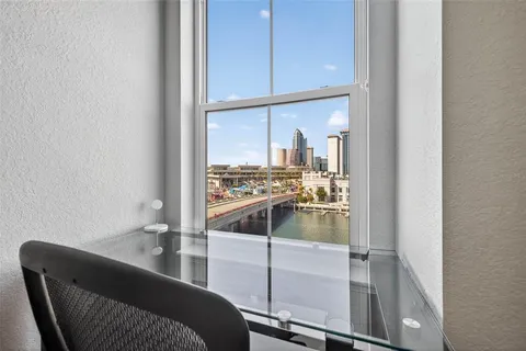 a kitchen with a refrigerator and sink