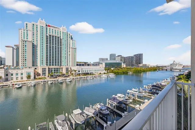 a view of a lake with tall buildings