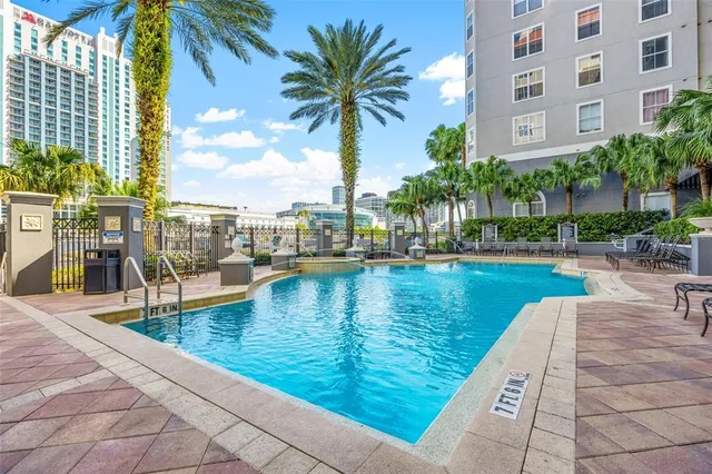 a view of a swimming pool with a lounge chairs