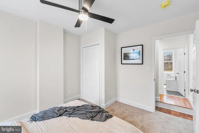 a bedroom with a bed and a view of bathroom