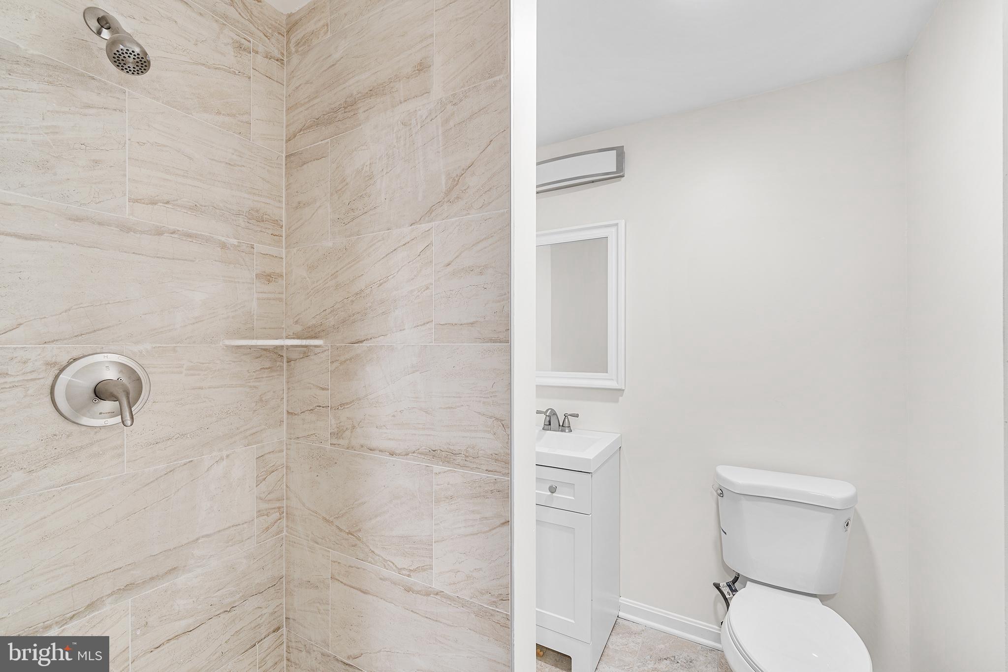 621 West 33rd Street Baltimore, MD 21211 - Photo 13 of 27 a bathroom with a toilet and a shower