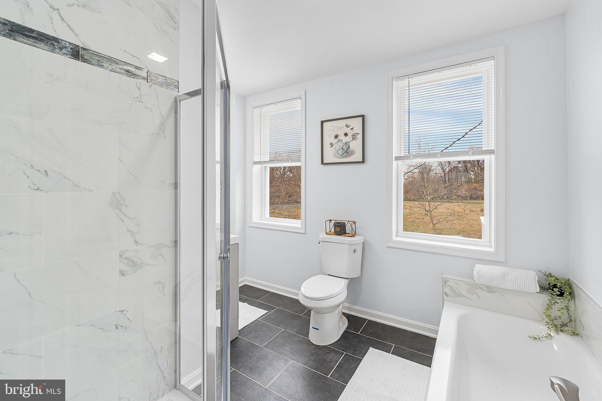 621 West 33rd Street Baltimore, MD 21211 - Photo 14 of 27 a bathroom with a toilet and a shower