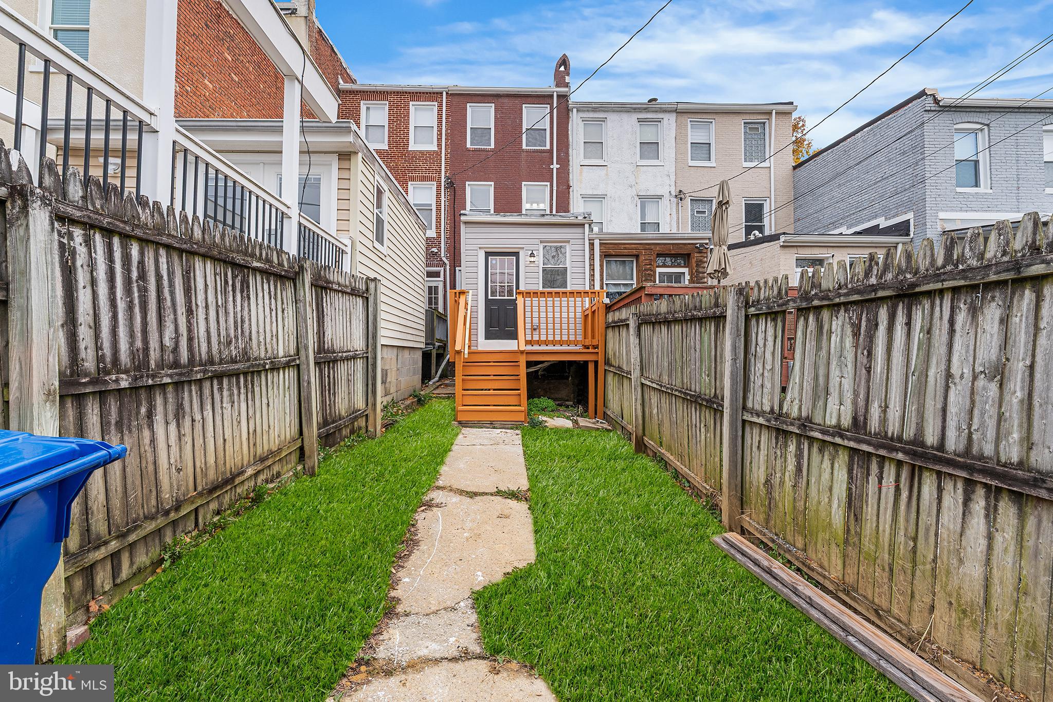 621 West 33rd Street Baltimore, MD 21211 - Photo 21 of 27 a view of a brick house with wooden fence