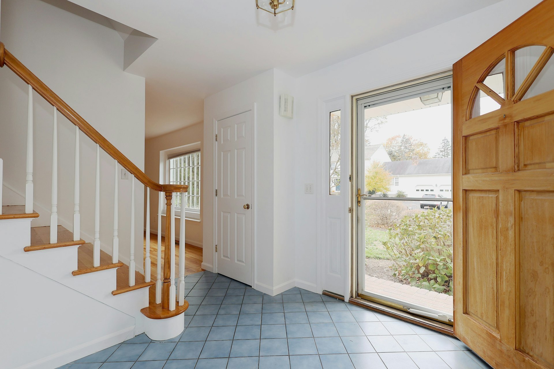 44 Deer Run Road Fairfield, CT 06824 - Photo 2 of 40 a view of an entryway with wooden floor and door