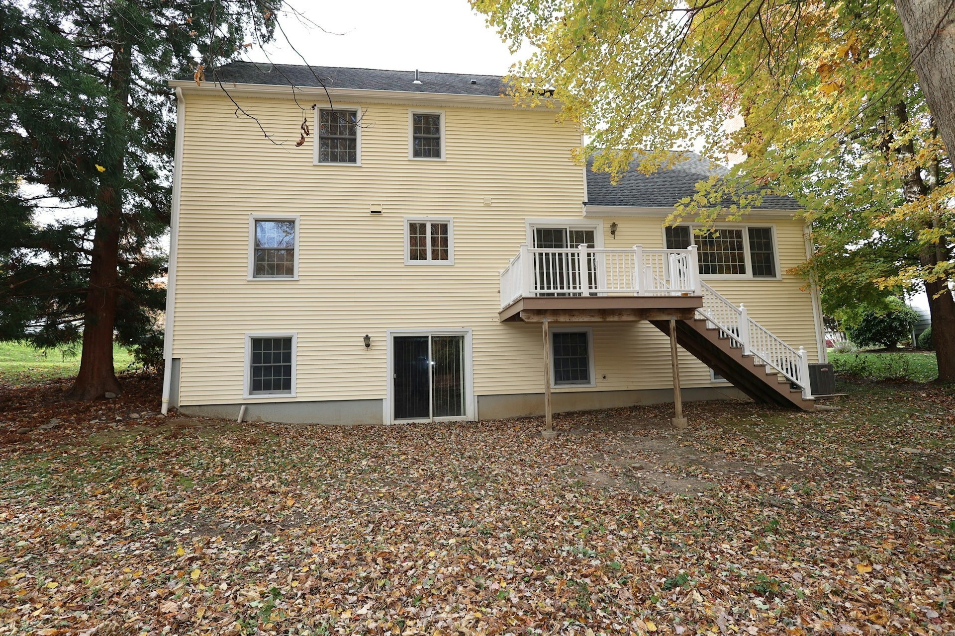 44 Deer Run Road Fairfield, CT 06824 - Photo 21 of 40 a white house that has a tree in front of it