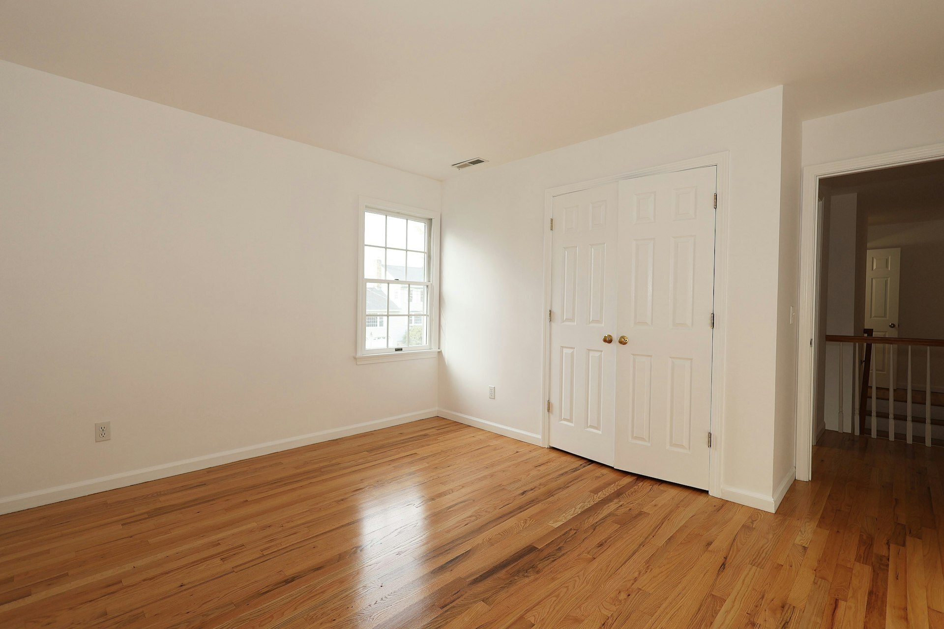 44 Deer Run Road Fairfield, CT 06824 - Photo 36 of 40 a view of an empty room with wooden floor and a window