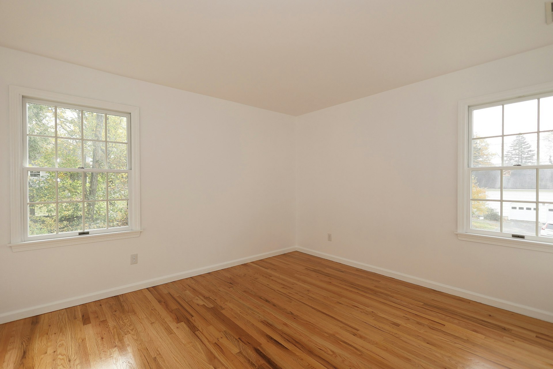 44 Deer Run Road Fairfield, CT 06824 - Photo 37 of 40 an empty room with wooden floor and windows