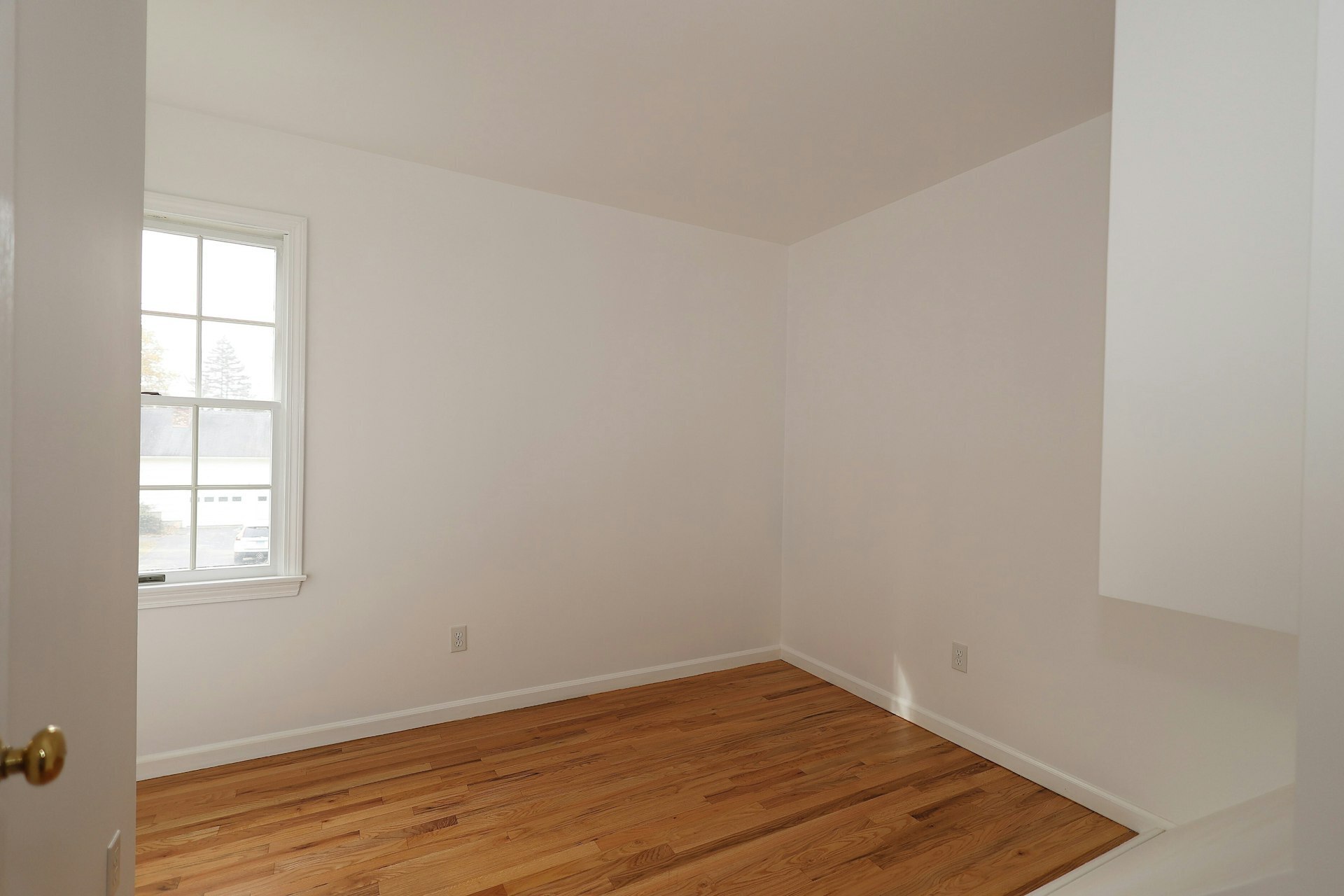 44 Deer Run Road Fairfield, CT 06824 - Photo 38 of 40 an empty room with wooden floor and windows