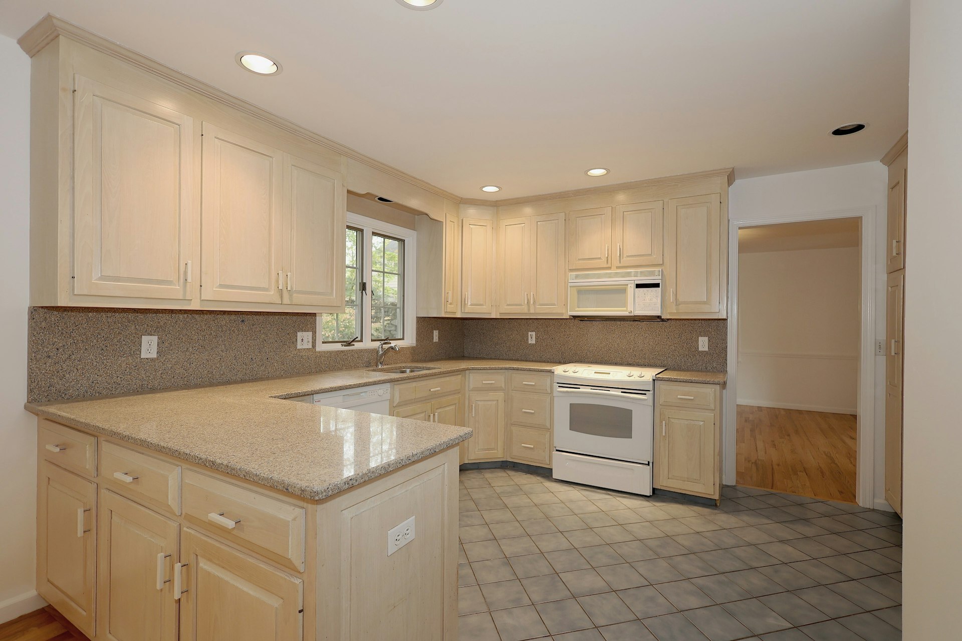 44 Deer Run Road Fairfield, CT 06824 - Photo 6 of 40 a kitchen with a stove sink and cabinets